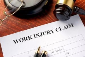 Work injury claim form on a table.
